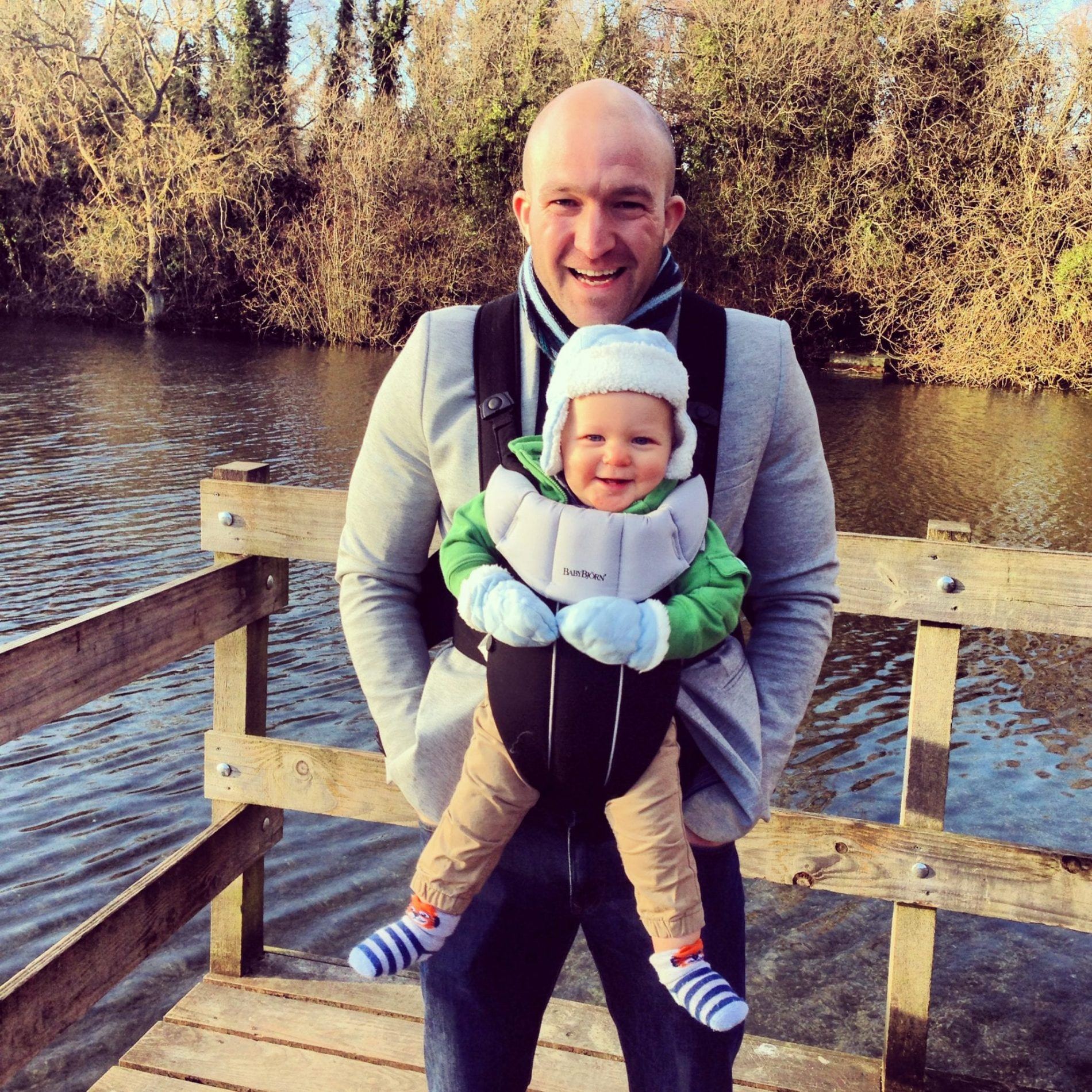 Man carrying baby in Baby Bjorn carrier