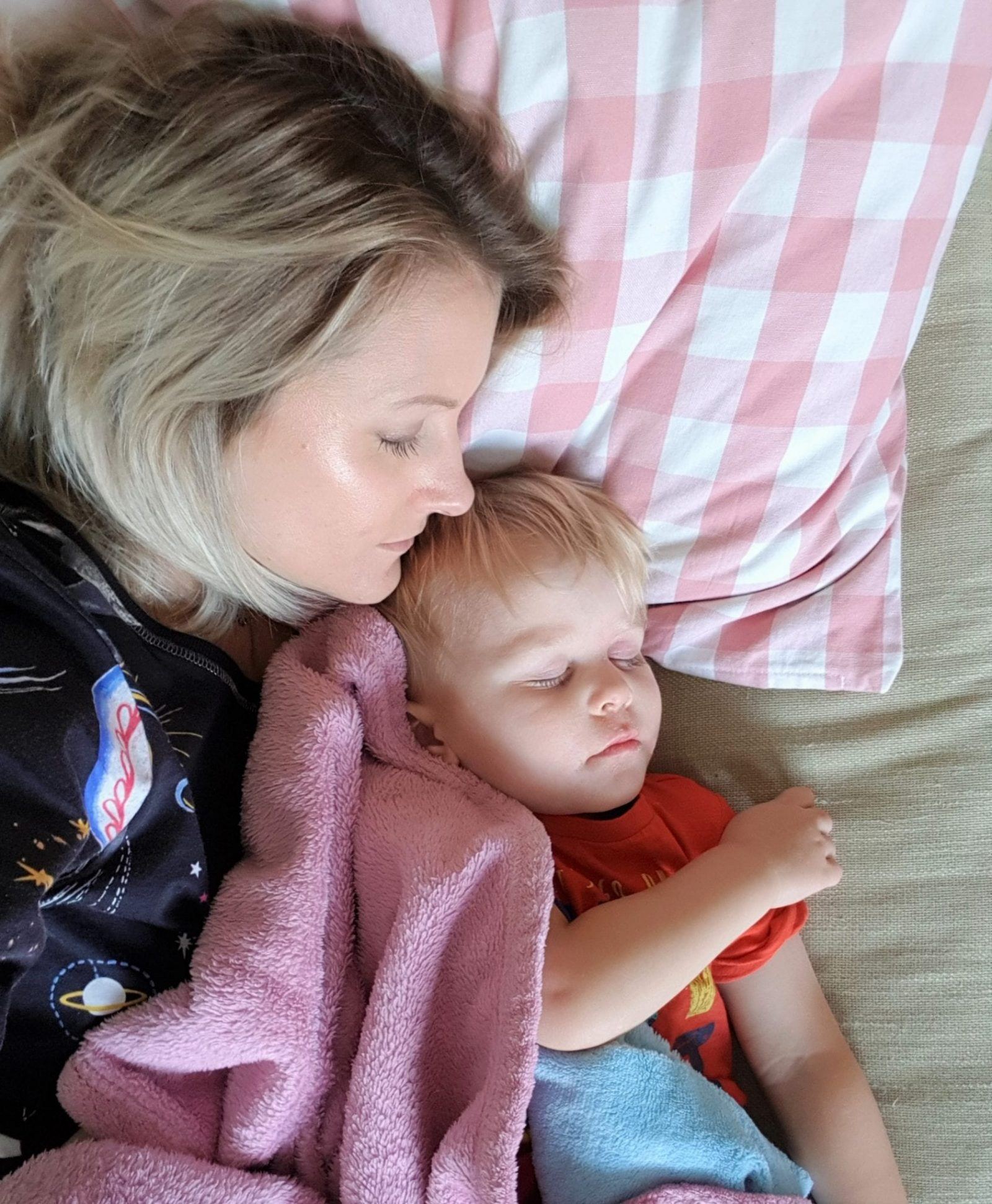 sick day snuggled with son on the sofa in autumn