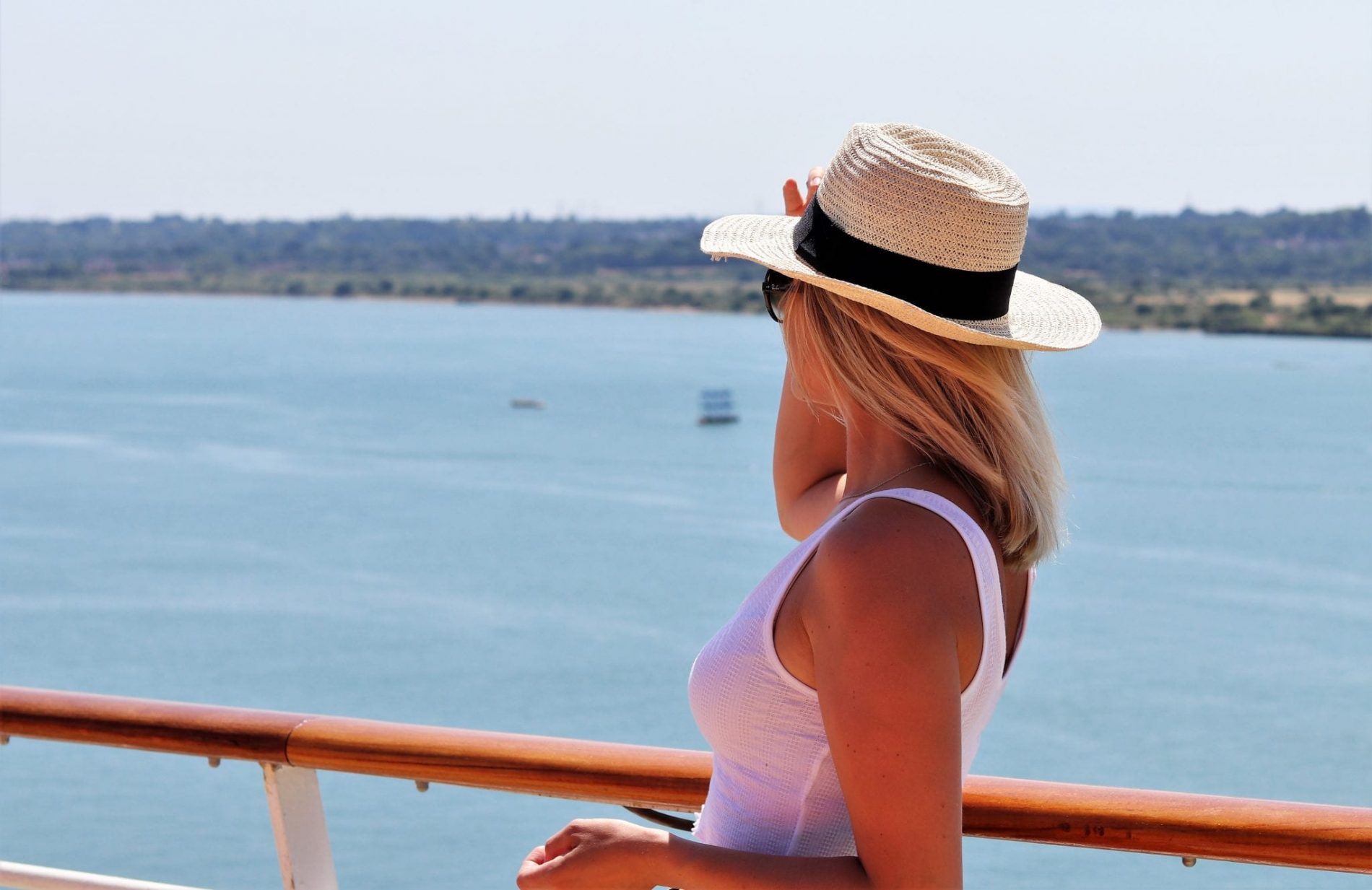 lady looking out to sea, reasons why to book a cruise for your next holiday