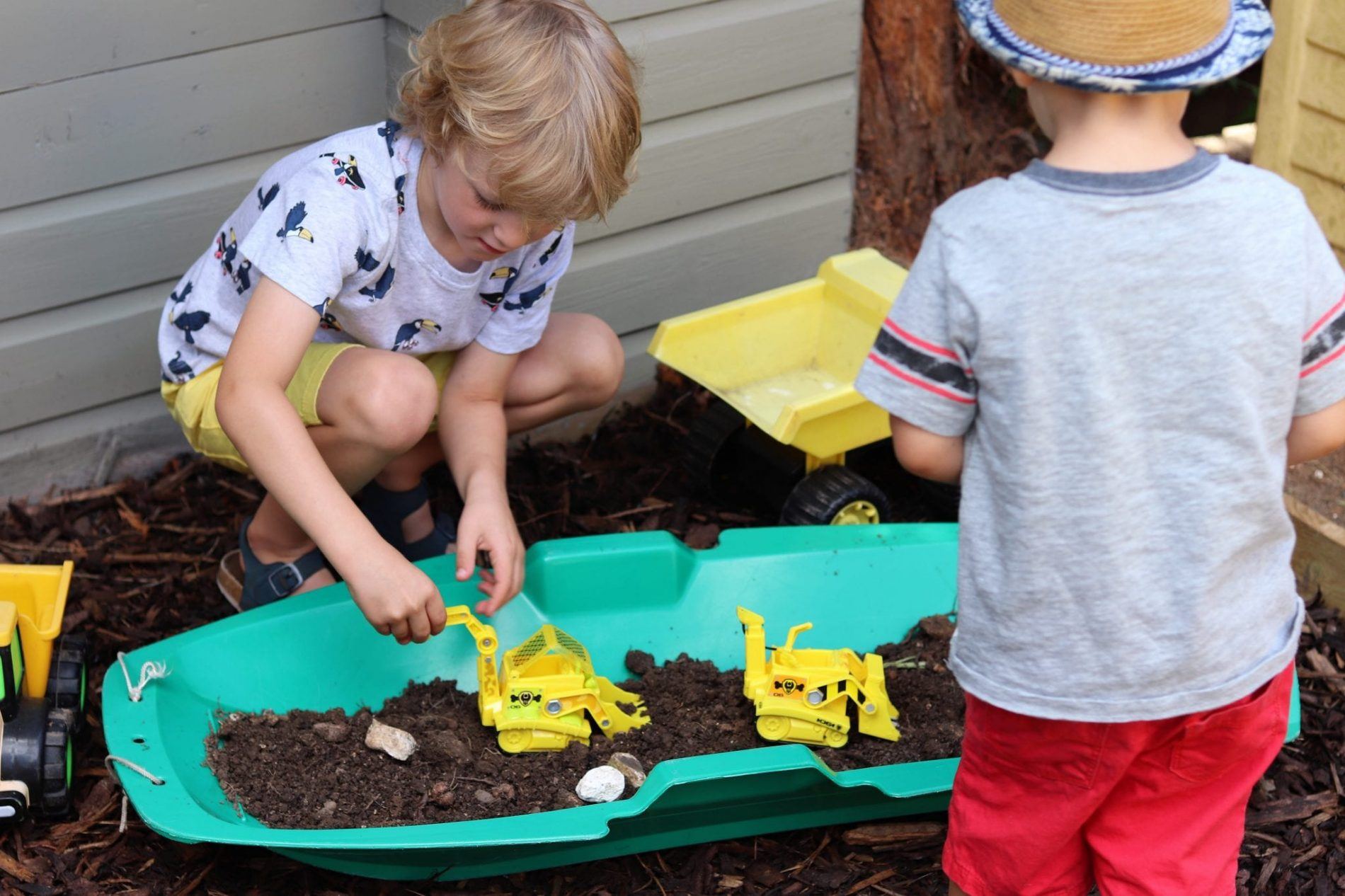 create a messy play station with diggers and mud
