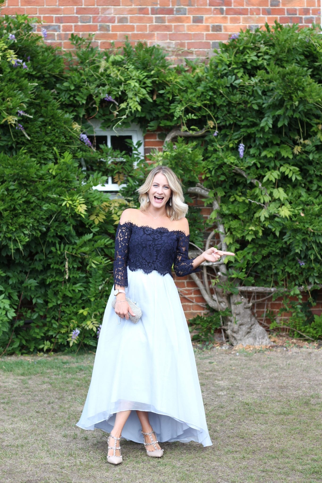 Lady dressed in Coast at a wedding in the summer