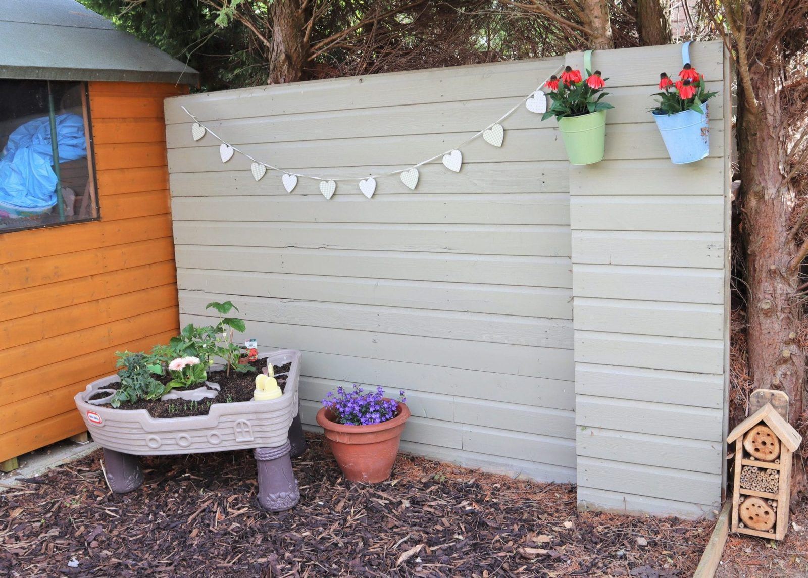 kids outdoors toy area in garden