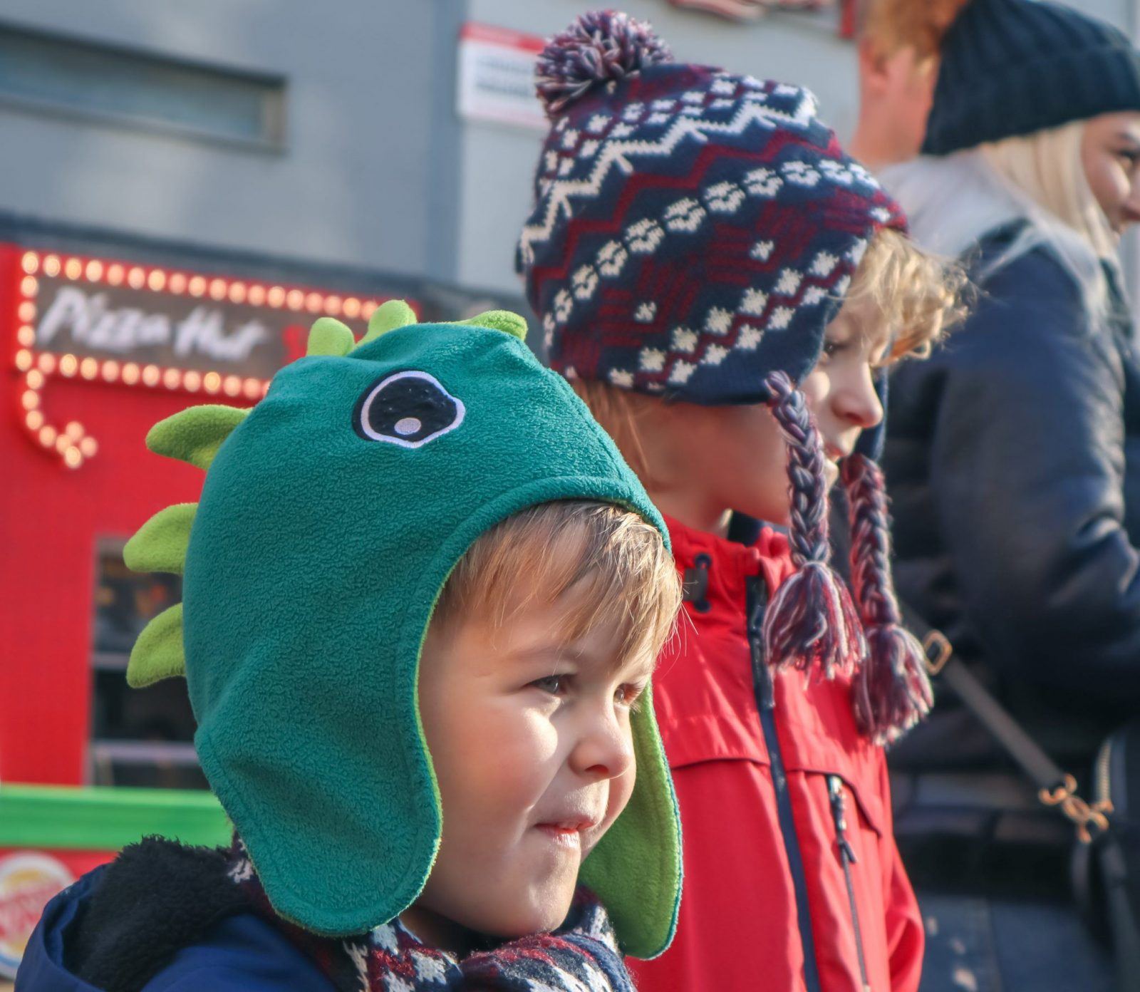 boys smiling at Christmas Family Day Out In Leicester Square