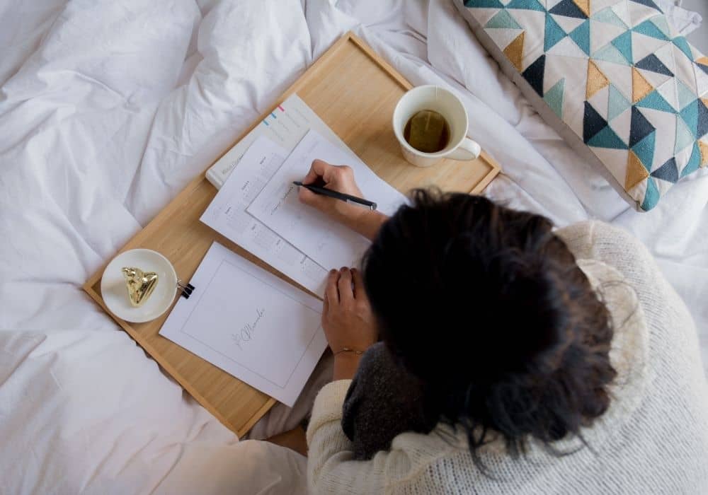 lady writing on paper