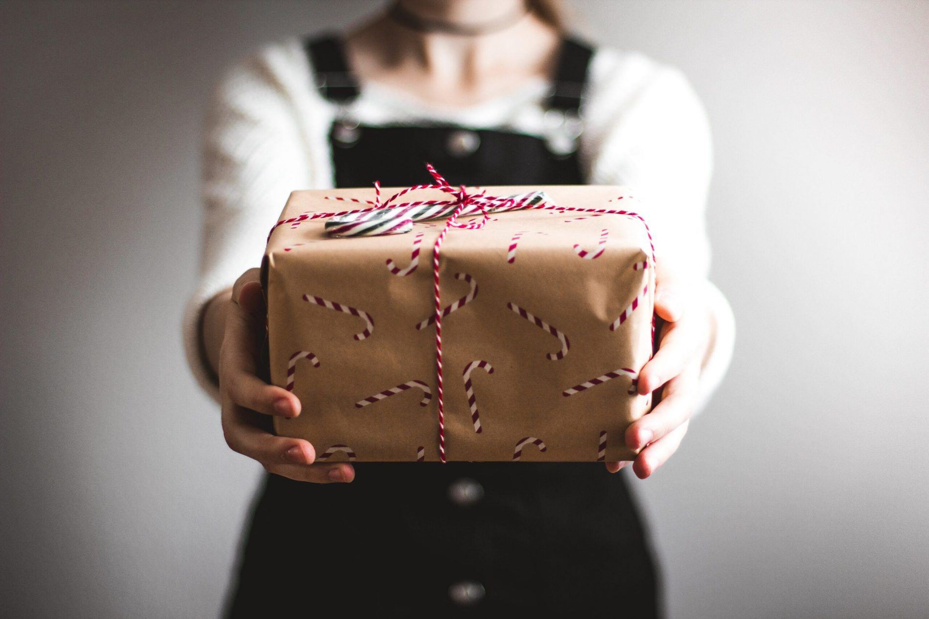 Christmas present held by someone