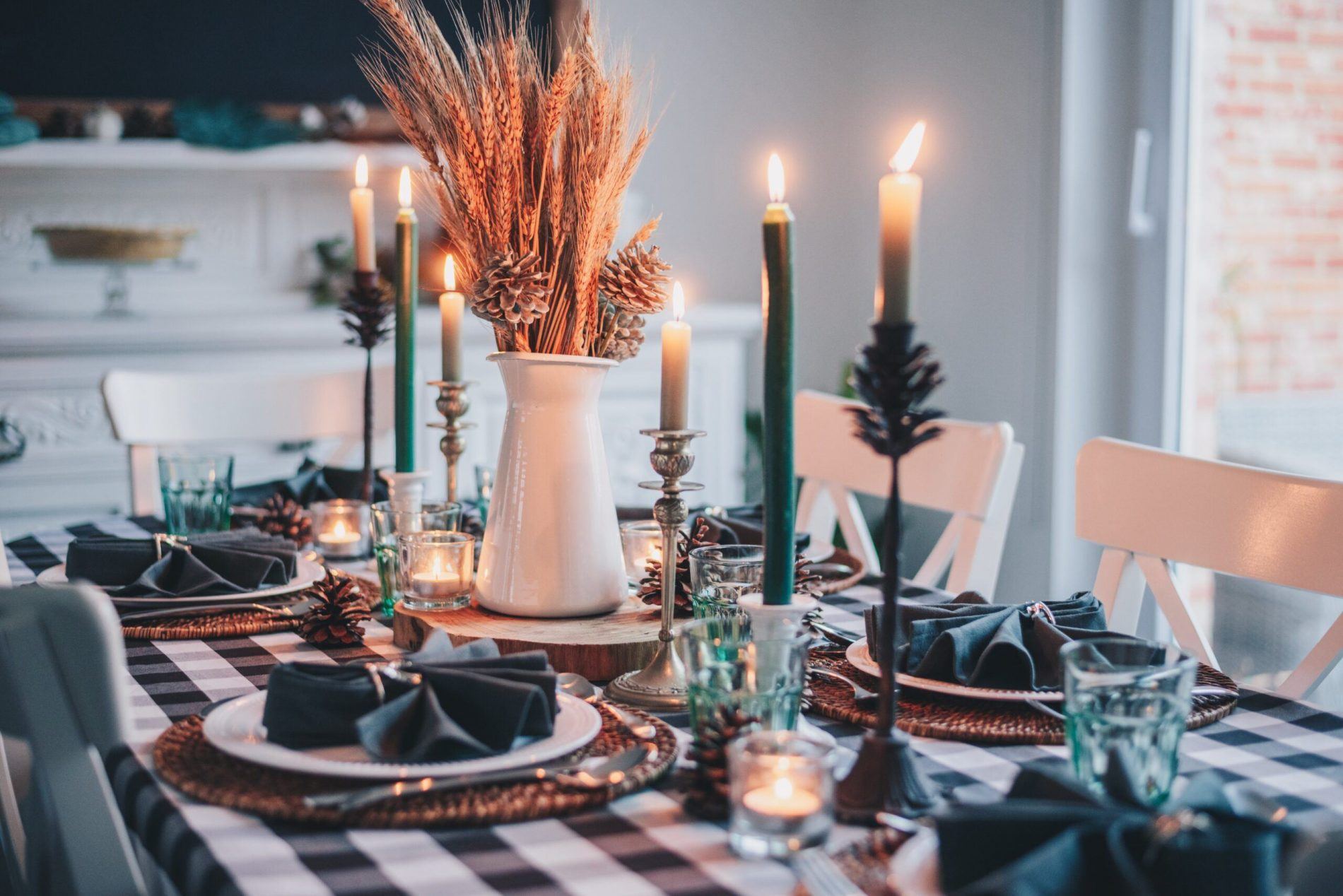pretty tablescape with candles and Christmas decorations budgeting for Christmas
