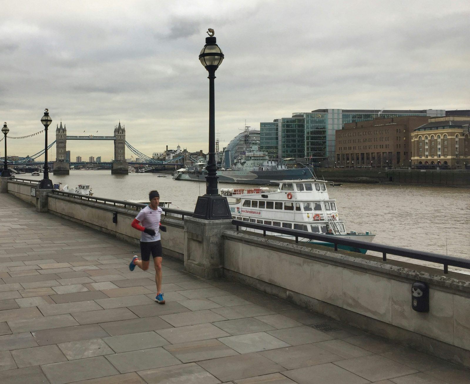 man running along the river in the london marathon 2025